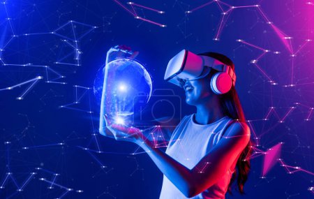 Photo for Female stand in cyberpunk neon light wear white VR headset and tank top connecting metaverse, future cyberspace community technology, She holding and see 3D hologram of global picture. Hallucination. - Royalty Free Image