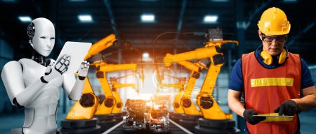 Téléchargez les photos : XAI Robot industriel mécanisé et travailleur humain travaillant ensemble dans la future usine. Concept d'intelligence artificielle pour la révolution industrielle et l'automatisation des processus de fabrication. - en image libre de droit