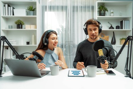Host channel broadcasters discussing together, making advice for problem in live streaming with listeners surrounded sets of live streaming on radio talking show at comfy modern workplace. Postulate.