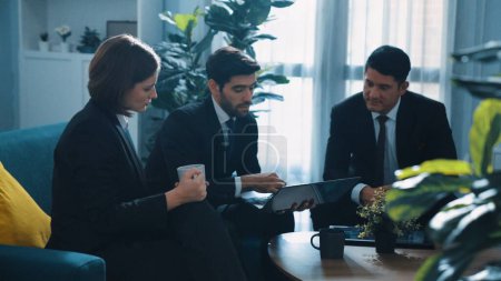 Photo for Top view of diverse business team planning marketing strategy at meeting room. Professional manager thinking and analyze stock investment chart from laptop while colleague sharing idea. Directorate. - Royalty Free Image