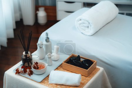 Photo for Exquisite display of beauty treatment and spa salon accessories arranged on spa table in luxury spa resort. Relaxing spa massage and recreation background concept. Quiescent - Royalty Free Image
