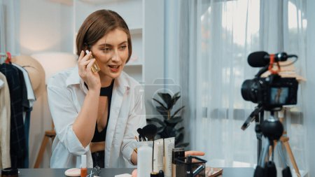 Photo for Woman influencer shoot live streaming vlog video review skincare for prim social media or blog. Happy young girl with cosmetics studio lighting for marketing recording session broadcasting online. - Royalty Free Image