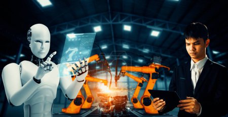Foto de XAI Robot industrial mecanizado y trabajador humano trabajando juntos en la futura fábrica. Concepto de inteligencia artificial para la revolución industrial y el proceso de fabricación de automatización. - Imagen libre de derechos