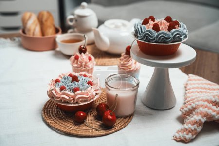 Photo for Presentation piece of cupcake on white standing cake with tea pot set in concept of pastel colors special cuisine. Content creative of social media with favorite sweets bakery dish. Tastemaker. - Royalty Free Image