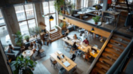 Photo for Defocused image of a lively modern co-working area with people and indoor plants. Resplendent. - Royalty Free Image