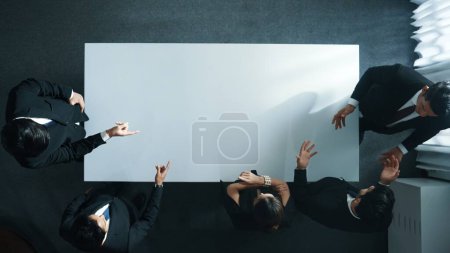 Photo for Top down aerial view of business team discuss about marketing strategy while project manager talking about financial plan. Diverse people brainstorming creative idea. Group plan project.. Directorate. - Royalty Free Image