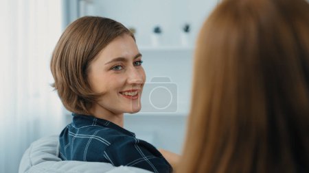 Photo for Happy patient and psychologist exchanging mental health conversation in clinic with positive emotion while explaining prim successful work and life to psychologist at psychologist clinic office - Royalty Free Image