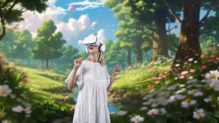 Photo for Impressive woman looking through VR in wonderland bokeh circle falling metaverse in wildflower forest fairytale getting fresh air meta world fantasy jungle natural imaginary creativity. Contraption. - Royalty Free Image