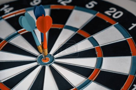 Photo for Concept of challenge in business marketing bullseye and intelligent customer reaching. The dart is the strategy or skill. The dartboard is the target or goal. uds - Royalty Free Image