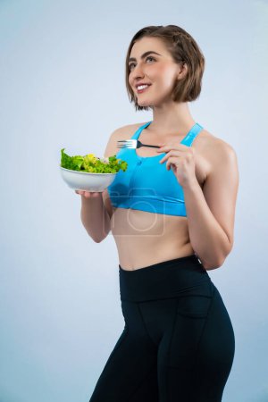 Photo for Full body length gaiety shot athletic and sporty young woman with healthy vegan food in standing posture on isolated background. Healthy active and body care by vegetarian lifestyle. - Royalty Free Image