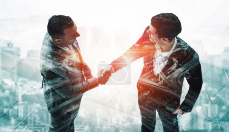 Photo for Double exposure image of business people handshake on city office building in background show partnership success of business deal. Concept of corporate teamwork, trust partner and work agreement. uds - Royalty Free Image