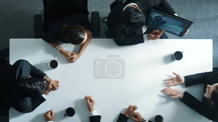 Photo for Top down aerial view of professional business people writing and sharing marketing idea on sticky note. Group of diverse executive manager working together or brainstorming strategy. Directorate. - Royalty Free Image