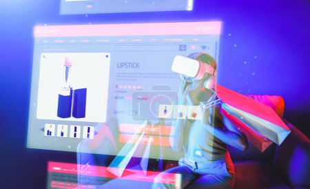 Smart female sitting on sofa while wearing VR headset connecting metaverse, future cyberspace community technology. Elegant woman enjoy opening online store menu shop luxury product. Hallucination.