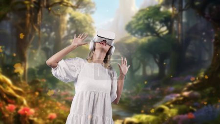 Photo for Woman in white dress looking around by VR glasses surrounded enchanted wonderful fairytale forest with maple leave falling meta magical world like fairy tale concept creative jungle tale. Contraption. - Royalty Free Image