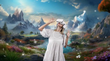 Photo for Excited smiling woman looking by VR surround wonderful fairytale forest mountain ice wonderland snowfall at steam water landscape meta magical world mysterious fantasy jungle in winter. Contraption.. - Royalty Free Image