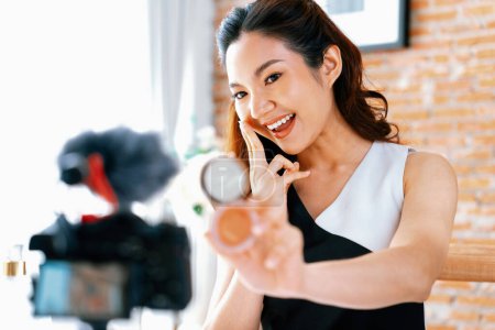 Photo for Woman influencer shoot live streaming vlog video review makeup uttermost social media or blog. Happy young girl with cosmetics studio lighting for marketing recording session broadcasting online. - Royalty Free Image