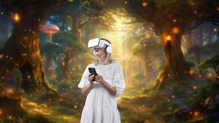 Photo for Excited girl using VR and smartphone to connect meta surround fantasy forest bokeh neon light falling magical beautiful wonderland wildflower explored fantastic mysterious dreamy world. Contraption. - Royalty Free Image