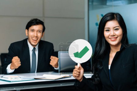 Human resource manager hire male employment candidate who pass interviewing, sitting in office room. Happy OK job interview. Job application, recruitment and Asian labor hiring concept. uds