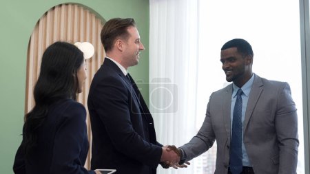 Photo for Ornament meeting room with group of diversity business people or office worker college shake hand after make successful business agreement deal. Business professionals greeting in workplace. - Royalty Free Image