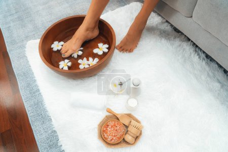 Photo for Panorama top view woman indulges in blissful foot massage at luxurious spa salon while masseur give reflexology therapy in gentle day light ambiance resort or hotel foot spa. Quiescent - Royalty Free Image