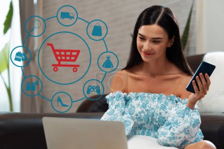 Photo for Elegant customer wearing blue dress controlling device choosing online platform. Smart consumer watching gadget opening e-commerce application using cashless technology shopping inventory. Cybercash. - Royalty Free Image