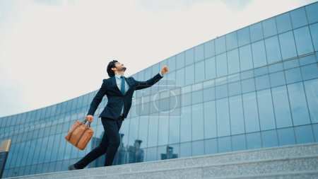 Photo for Successful business man celebrate increasing sales while standing. Happy project manager or leader proud with successful project, getting a promotion, getting a job. Overjoy and happy. Exultant. - Royalty Free Image