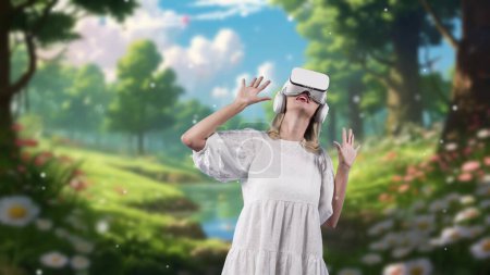 Photo for Excited woman looking around VR surround enchant wonderful fairytale forest in wild flower with snowfall at steam water in meta magical world like fairy tale in flower jungle timer tale. Contraption. - Royalty Free Image