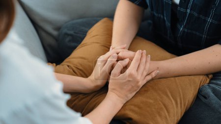 Photo for Supportive and comforting hands cheering up depressed patient person or stressed mind with prim empathy. Psychologist reassuring stressful and sad patient in clinic. - Royalty Free Image