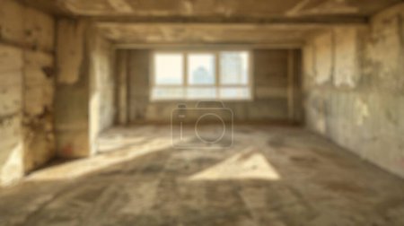 Blur background of concrete building interior with sunlit windows. Urban decay design. Abandoned places and renovation project concept. Design for documentary, urban exploration magazine. Spate.